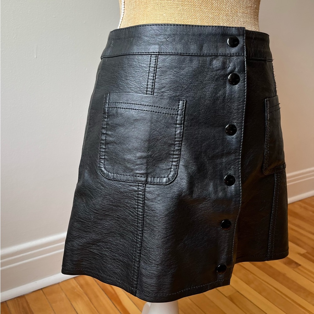 Pleather mini skirt with snap buttons and pockets